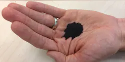 Mineral-coated sand could unlock new water supply by removing two kinds of contamination.