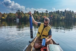 Corey Laxson from the Paul Smith&rsquo;s College Adirondack Watershed Institute preparing to deploy a YSI EXO3 sonde in Mirror Lake.