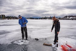 Collecting water samples through the ice on Mirror Lake.