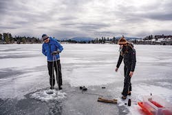Collecting water samples through the ice on Mirror Lake. Collecting water samples through the ice on Mirror Lake.