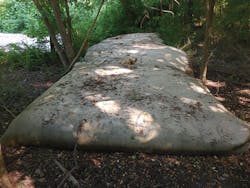 These geotubes receive slurry and dewater it over time. These geotubes receive slurry and dewater it over time.