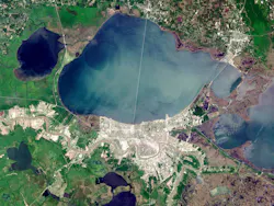 A NASA satellite image of New Orleans and Lake Pontchartrain. The smaller Lake Maurepas is on the left, with the swamp along its southern shore.