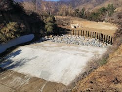 A retrofit done on Leach Canyon Dam ahead of the first significant post-fire rain event. A retrofit done on Leach Canyon Dam ahead of the first significant post-fire rain event.