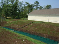 A stream bank restoration at Camp Lejeune leading to a retention pond. The project used erosion control socks with McGill SoilBuilder Premium Compost.