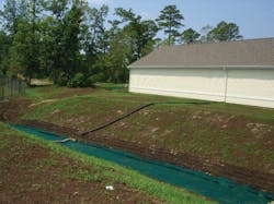 A stream bank restoration at Camp Lejeune leading to a retention pond. The project used erosion control socks with McGill SoilBuilder Premium Compost. A stream bank restoration at Camp Lejeune leading to a retention pond. The project used erosion control socks with McGill SoilBuilder Premium Compost.
