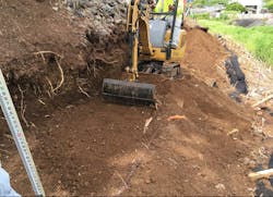 Figure 4. Subgrade preparation using a smooth bucket on a mini-excavator Figure 4. Subgrade preparation using a smooth bucket on a mini-excavator
