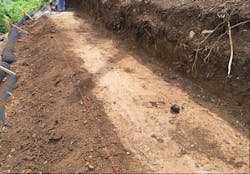 Figure 5. Compacted (proof-rolled) subgrade ready for first geosynthetic wrap lift Figure 5. Compacted (proof-rolled) subgrade ready for first geosynthetic wrap lift