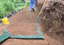 Figure 9. A thin layer of soil is spread before adding the next wrap-lift. Figure 9. A thin layer of soil is spread before adding the next wrap-lift.