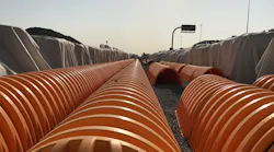 The system of arch-shaped chambers in multiple tanks was buried with up to 3.96 meters (13 feet) of cover.