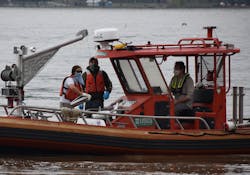 A USGS field team, including Pat Bowen, Kate Bowen, and John Trainor, uses specialized equipment to measure spring floodwaters at Chesapeake Bay's largest tributary, the Susquehanna River in Maryland. The team has an interesting strategy to deal with conflicts between sample-collection protocols and Covid-19 safe-distancing recommendations. Pat and Kate are married, so they can safely work together, while John maintains a safe distance at the helm. A USGS field team, including Pat Bowen, Kate Bowen, and John Trainor, uses specialized equipment to measure spring floodwaters at Chesapeake Bay's largest tributary, the Susquehanna River in Maryland. The team has an interesting strategy to deal with conflicts between sample-collection protocols and Covid-19 safe-distancing recommendations. Pat and Kate are married, so they can safely work together, while John maintains a safe distance at the helm.