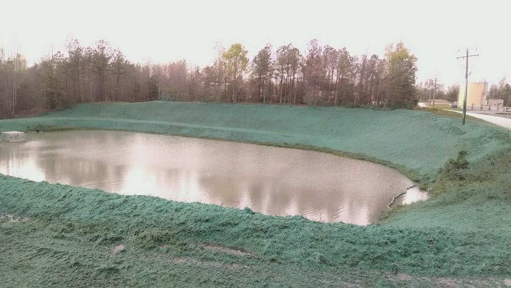 Hydroseeding with a Bonded Fiber Matrix (BFM) or a Flexible Growth Medium (FGM) is a good option on sediment pond slopes. Here, Flexterra was used for stabilization and vegetation at a sediment pond.