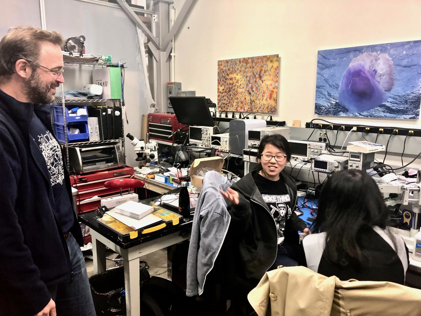 Allan Adams, physicist and principal investigator of the Future Ocean Lab at MIT, and student Charlene work on developing an optical sensor that uses light and acoustics to detect nitrogen and other components in the ocean.