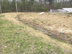 Stormwater collection swale located down gradient of solar array. Stormwater collection swale located down gradient of solar array.