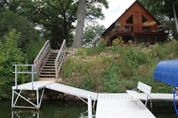 Pre-construction, the lake-side slope was overrun with invasive species. Pre-construction, the lake-side slope was overrun with invasive species.