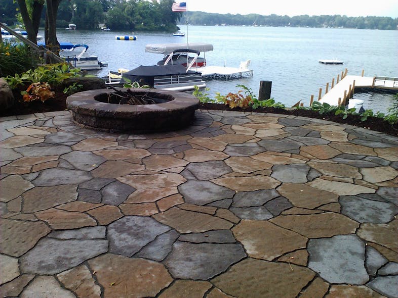 The finished zero-edge view firepit patio overlooking Lake Wisconsin.