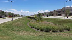 A dry swale in a housing development in Texas