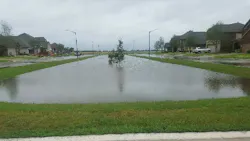 The same swale during Hurricane Harvey in 2017