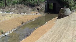 A sloped streambank gives way to a broad floodplain reducing erosion and flood risk to existing sewer infrastructure. A sloped streambank gives way to a broad floodplain reducing erosion and flood risk to existing sewer infrastructure.