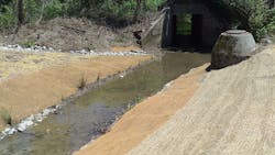 A sloped streambank gives way to a broad floodplain reducing erosion and flood risk to existing sewer infrastructure. A sloped streambank gives way to a broad floodplain reducing erosion and flood risk to existing sewer infrastructure.