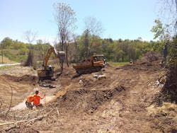 Staff from Baker Grading and Landscaping at work recontouring eroding streambanks to prevent erosion. Staff from Baker Grading and Landscaping at work recontouring eroding streambanks to prevent erosion.