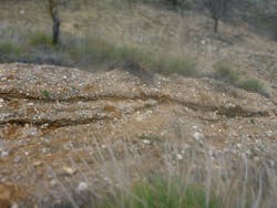 Rill erosion occurring on farmland in Rest&aacute;bal, southern Spain.