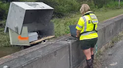Lori Lewis, USGS hydrologic technician, verifies the readings of a USGS streamgage located on Bayou Marcus in Pensacola, FL, on September 17, 2020.