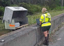Lori Lewis, USGS hydrologic technician, verifies the readings of a USGS streamgage located on Bayou Marcus in Pensacola, FL, on September 17, 2020. Lori Lewis, USGS hydrologic technician, verifies the readings of a USGS streamgage located on Bayou Marcus in Pensacola, FL, on September 17, 2020.