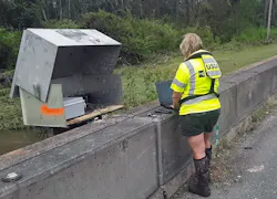 Lori Lewis, USGS hydrologic technician, verifies the readings of a USGS streamgage located on Bayou Marcus in Pensacola, FL, on September 17, 2020.
