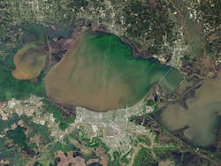 An algae bloom was captured by Landsat 8 on Louisiana’s Lake Pontchartrain in March 2018. The green bloom on the upper right of the lake was caused, in part, by unusually warm temperatures that year. An algae bloom was captured by Landsat 8 on Louisiana’s Lake Pontchartrain in March 2018. The green bloom on the upper right of the lake was caused, in part, by unusually warm temperatures that year.