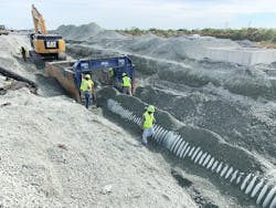 The stone that was brought in to create the site also served as backfill material for the thermoplastic stormwater drainage pipe. The stone that was brought in to create the site also served as backfill material for the thermoplastic stormwater drainage pipe.