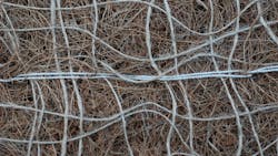 Flexible biodegradable netting controls erosion and allows wildlife to escape. Flexible biodegradable netting controls erosion and allows wildlife to escape.
