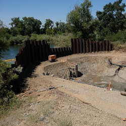 The system comprises eight dewatering pumps in narrow well casings at either side of the trench. The system comprises eight dewatering pumps in narrow well casings at either side of the trench.