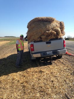 Minnesota DOT Inspector Adam Wick prepares to install biodegradable erosion control matting. Minnesota DOT Inspector Adam Wick prepares to install biodegradable erosion control matting.