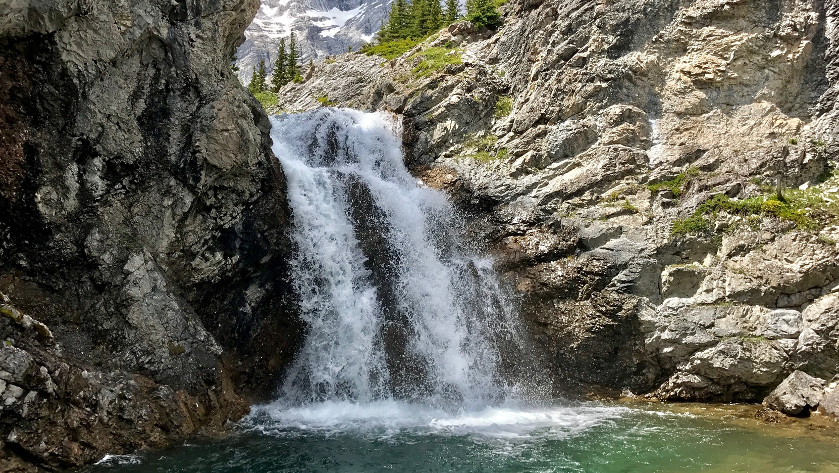 A small waterfall in Elbow Lake, Canada.