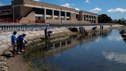 Students from Morehead City Middle School and Teacher’s Pet participated in planting over 26,000 plugs of smooth cordgrass and saltmeadow along the Carteret Community College’s Bogue Sound shoreline. Students from Morehead City Middle School and Teacher’s Pet participated in planting over 26,000 plugs of smooth cordgrass and saltmeadow along the Carteret Community College’s Bogue Sound shoreline.