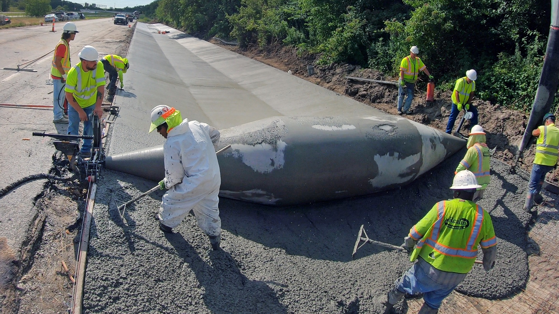 Curb Roller Manufacturing created a 24-foot-wide custom drum to complete a Missouri ditch liner project. Realm Construction poured 400-450 linear feet of concrete a day and finished the project more than one week ahead of schedule.