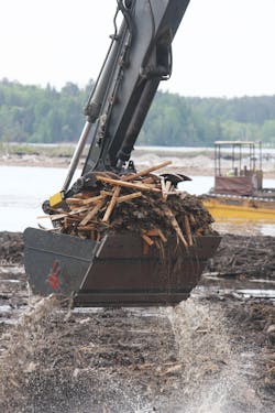 MAE was tasked with removing vast amounts of submerged, century-old wood waste as part of the Grassy Point project. MAE was tasked with removing vast amounts of submerged, century-old wood waste as part of the Grassy Point project.