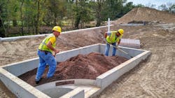 Workers install a BioPod unit. Here, they’re adding a unit’s 18-inch layer of StormMix media topped with 2 inches of shredded mulch. Workers install a BioPod unit. Here, they’re adding a unit’s 18-inch layer of StormMix media topped with 2 inches of shredded mulch.