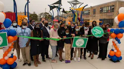 Officials, stakeholders and students at Mann Elementary School cut the ribbon on the new green schoolyard.