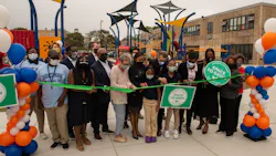 Officials, stakeholders and students at Mann Elementary School cut the ribbon on the new green schoolyard.