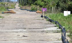Proper signage at areas such as this wetland crossing can improve awareness and assist with permit special provision compliance. Proper signage at areas such as this wetland crossing can improve awareness and assist with permit special provision compliance.