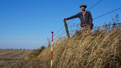 Isaac Larsen standing on the erosional escarpment at Stinton Prairie, Iowa. Isaac Larsen standing on the erosional escarpment at Stinton Prairie, Iowa.
