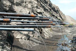 The project employed over 113 miles of horizontal drains, blanket drains, trench drains, slope ditches, and under drains during construction. The project employed over 113 miles of horizontal drains, blanket drains, trench drains, slope ditches, and under drains during construction.