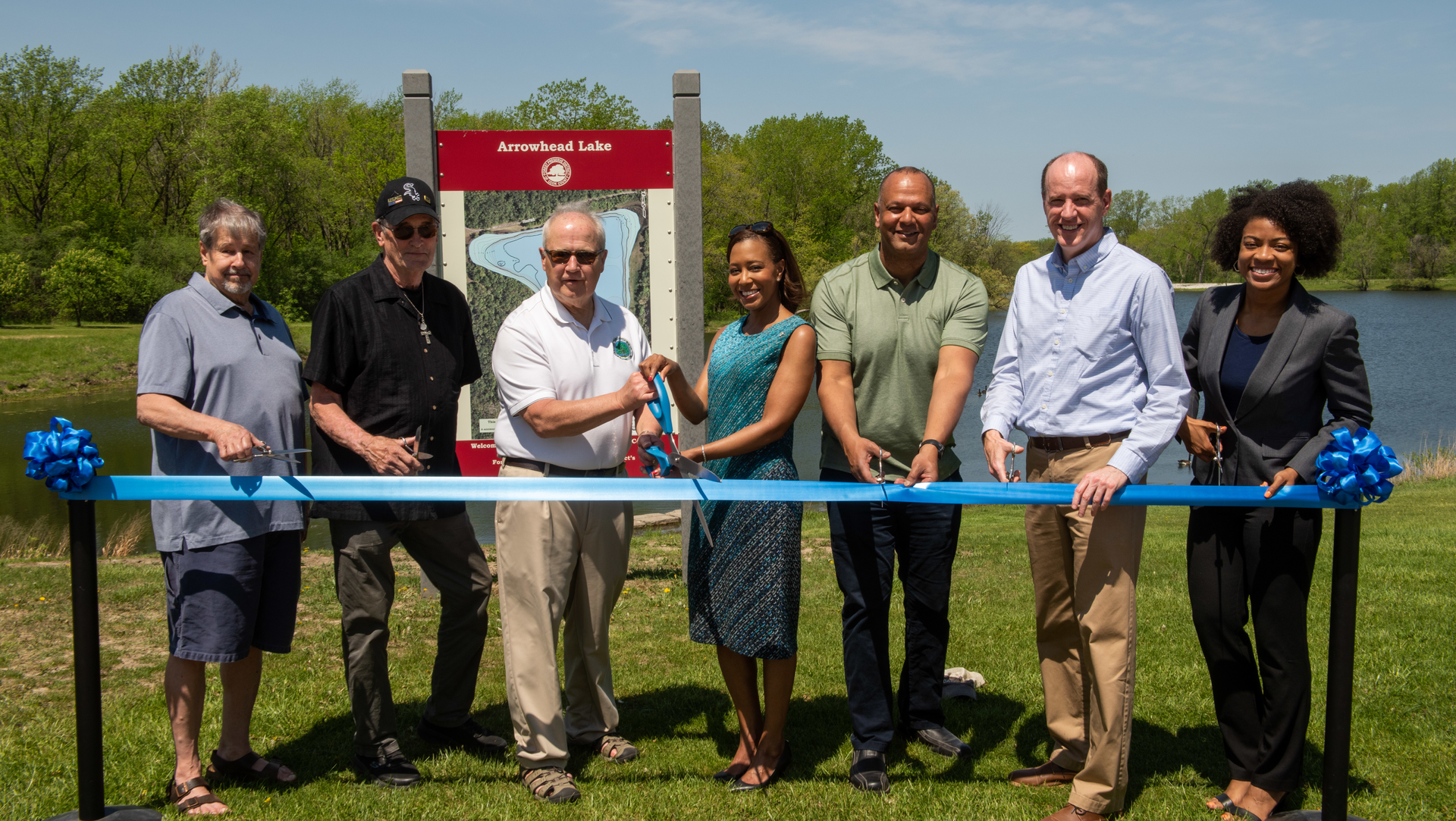 In the photo (L-R): Palos Heights 1st Ward Ald. Donald Bylut, and 2nd Ward Ald. Jack Clifford, Palos Heights Mayor Robert Straz, MWRD President Kari K. Steele, FPCC General Superintendent Arnold Randall, State Senator Bill Cunningham (18th District) and MWRD Commissioner Chakena D. Perry cut the ribbon on the Arrowhead Lake Flood Control Project.