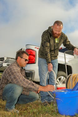 Lower Loup NRD Water Programs Specialist Jason Moudry and Projects Technician Brian Kolar check a monitoring well at Columbus. The LLNRD is in the process of installing an innovative structure to increase groundwater levels on Columbus’ east side. Lower Loup NRD Water Programs Specialist Jason Moudry and Projects Technician Brian Kolar check a monitoring well at Columbus. The LLNRD is in the process of installing an innovative structure to increase groundwater levels on Columbus’ east side.