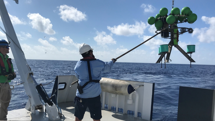 Researchers deploy a mooring, which will help them measure exchanges of waters.