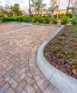 The Belgard permeable paver system, featuring Eco-Holland pavers, was designed to meet the stormwater quality and storage requirements of the St. Johns River Water Management District while providing a robust, long-lasting, and easy to maintain driving surface. The Belgard permeable paver system, featuring Eco-Holland pavers, was designed to meet the stormwater quality and storage requirements of the St. Johns River Water Management District while providing a robust, long-lasting, and easy to maintain driving surface.