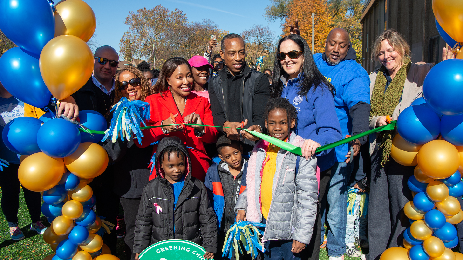 Space to Grow partners and school members celebrate the new schoolyard at Coles School with students.