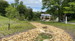 The dry stream bed, located along Woodland Road on Chatham University's campus works in tandem with underground storage to slowly release stormwater into the sewer system. The stones, engineered soils, and plants within the streambed mimic nature helping to slow stormwater runoff.