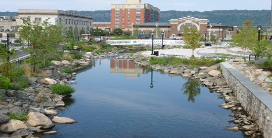 1654811709240 04f View Looking West Of The Completed Park And River Showing Train Station